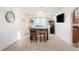 Formal dining room with elegant wainscoting and modern lighting fixtures at 6476 Snowden Dr, Atlanta, GA 30349