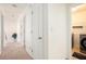 Hallway view showing the laundry room with modern washer and dryer units at 6476 Snowden Dr, Atlanta, GA 30349