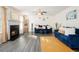 Inviting living room with a cozy fireplace and stylish blue couches at 6476 Snowden Dr, Atlanta, GA 30349