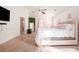 Spacious main bedroom with a luxurious pink bed and ensuite bathroom at 6476 Snowden Dr, Atlanta, GA 30349