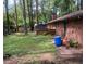 Large backyard with trees and a patio area at 2328 Columbia Dr, Decatur, GA 30032
