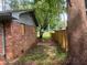 Brick home with a side yard and wooden fence at 2328 Columbia Dr, Decatur, GA 30032