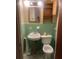 Small bathroom with green tile and a pedestal sink at 2328 Columbia Dr, Decatur, GA 30032