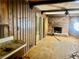 Dining room with wood paneling, brick fireplace, and hardwood floors at 2328 Columbia Dr, Decatur, GA 30032