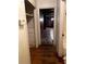 Hallway with wood floors and access to other rooms, needs renovation at 2328 Columbia Dr, Decatur, GA 30032