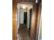 Hallway with wood paneling and hardwood floors, needs renovation at 2328 Columbia Dr, Decatur, GA 30032