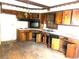 Dated kitchen with wood cabinets and appliances, needs renovation at 2328 Columbia Dr, Decatur, GA 30032