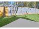 The home has a backyard with a wooden fence and a concrete patio at 2190 Lang Sw Dr, Atlanta, GA 30315