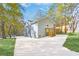 Back exterior shows a well-maintained home with updated stairs and a large driveway at 2190 Lang Sw Dr, Atlanta, GA 30315