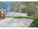 The home has a spacious backyard with a wooden fence and a concrete patio at 2190 Lang Sw Dr, Atlanta, GA 30315