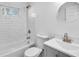 Neutral bathroom offers a tiled shower-tub and a modern-style vanity with an updated faucet at 2190 Lang Sw Dr, Atlanta, GA 30315