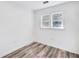 Bright bedroom features wood-look flooring, neutral walls, and double-hung windows at 2190 Lang Sw Dr, Atlanta, GA 30315