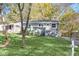Charming single-story home boasts a well-maintained lawn and inviting front entrance with white stairs and gray accents at 2190 Lang Sw Dr, Atlanta, GA 30315