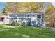 Charming single-story home boasts a well-maintained lawn and inviting front entrance with white stairs and gray accents at 2190 Lang Sw Dr, Atlanta, GA 30315