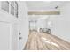 Bright living room with open floor plan, exposed beam, hardwood floors, and natural light at 2190 Lang Sw Dr, Atlanta, GA 30315