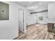 Open-plan living space leads to a modern kitchen and natural light at 2190 Lang Sw Dr, Atlanta, GA 30315