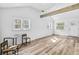 Bright open-plan living room features wooden floors, beam and large windows at 2190 Lang Sw Dr, Atlanta, GA 30315