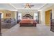 Spacious main bedroom featuring a sitting area, tray ceilings, and ample natural light at 189 Osier Dr, Mcdonough, GA 30252