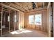 Unfinished room with wood framing and new windows at 4815 Briscoe Dr, Cumming, GA 30028