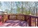 The wooden back deck overlooks a wooded and private backyard with mature trees at 208 Kenninghall Ln # 627, Smyrna, GA 30082