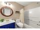 Full bathroom with vanity, wood framed mirror, toilet and shower with curtain at 208 Kenninghall Ln # 627, Smyrna, GA 30082