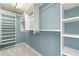 Walk-in closet features built-in shelving and ample storage space at 208 Kenninghall Ln # 627, Smyrna, GA 30082