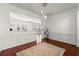 Dining room with decorative rug, wainscoting and view of kitchen at 208 Kenninghall Ln # 627, Smyrna, GA 30082