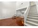 Bright living room with soaring ceilings, hardwood floors, and a staircase at 208 Kenninghall Ln # 627, Smyrna, GA 30082