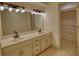 Bright bathroom with a double vanity at 110 Cove Ln, Social Circle, GA 30025