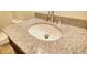 Close up of a bathroom featuring granite countertops and updated faucet hardware at 110 Cove Ln, Social Circle, GA 30025