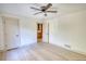 Bright bedroom with a ceiling fan, and two doors at 110 Cove Ln, Social Circle, GA 30025