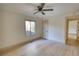 Bright bedroom with a ceiling fan, and a window at 110 Cove Ln, Social Circle, GA 30025