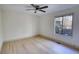 Bright bedroom with a ceiling fan, and a large window at 110 Cove Ln, Social Circle, GA 30025