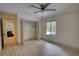 Bright bedroom with a ceiling fan, walk-in closet and a large window at 110 Cove Ln, Social Circle, GA 30025