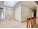 Bright foyer featuring a skylight, glass panel front door, and modern flooring at 110 Cove Ln, Social Circle, GA 30025