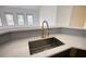 Kitchen sink with a modern gold faucet and ample counter space at 110 Cove Ln, Social Circle, GA 30025