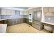 Bright kitchen with built-in stainless steel appliances, white countertops, and ample cabinet space at 110 Cove Ln, Social Circle, GA 30025