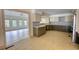 Spacious kitchen with modern two-tone cabinets and an adjacent area that is open and bright at 110 Cove Ln, Social Circle, GA 30025