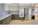 Kitchen boasts stainless steel appliances, modern counters, and convenient layout for cooking at 110 Cove Ln, Social Circle, GA 30025
