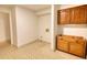 Unfinished laundry room, featuring a tile floor, connections, and unfinished wooden cabinets at 110 Cove Ln, Social Circle, GA 30025