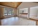 Bright living room featuring wood ceiling and sliding glass doors to the backyard pool at 110 Cove Ln, Social Circle, GA 30025