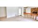 Bright living room featuring a stone fireplace, and seamless transition to other areas at 110 Cove Ln, Social Circle, GA 30025