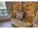 Cozy living room with a stone fireplace, neutral walls, and large windows bringing in natural light at 110 Cove Ln, Social Circle, GA 30025