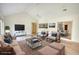 Staged living room featuring vaulted ceiling, neutral colors, and seamless flow to the kitchen and dining area at 110 Cove Ln, Social Circle, GA 30025