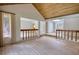 Open-concept living room with wood ceiling, modern flooring, and seamless transition to foyer at 110 Cove Ln, Social Circle, GA 30025