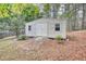 Outdoor storage shed with double doors and windows for gardening at 110 Cove Ln, Social Circle, GA 30025