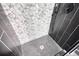 Modern shower featuring stylish tile walls and floor at 110 Cove Ln, Social Circle, GA 30025