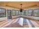 Bright sunroom featuring many windows, letting in lots of natural light and backyard view at 110 Cove Ln, Social Circle, GA 30025