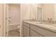 Bathroom with granite countertops, double sinks, and a shower/tub combo at 359 Orwell Dr, Social Circle, GA 30025