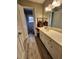 Bathroom featuring tile floors, updated vanity, and large mirror at 2479 Landeau Cir, Tucker, GA 30084
